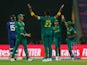 South Africa celebrate taking a wicket against England at the Cricket World Cup on October 21, 2023.